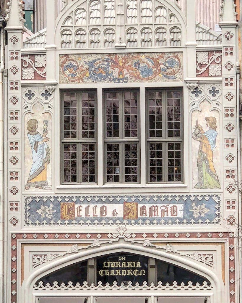 Artistic facade of the iconic Lello Bookstore in Porto, Portugal with detailed architecture.