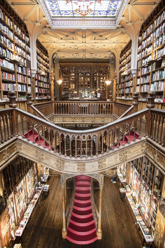 Stunning view of the iconic Livraria Lello's grand staircase and bookshelves in Porto, Portugal.